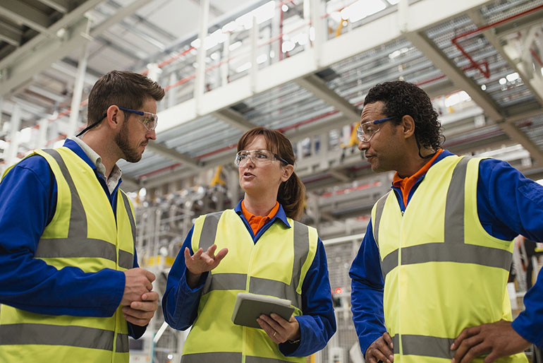 Factory Workers Having a Discussion